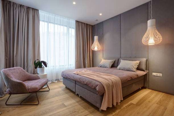 The room, tinged with purple, emitted light from a white lampshades